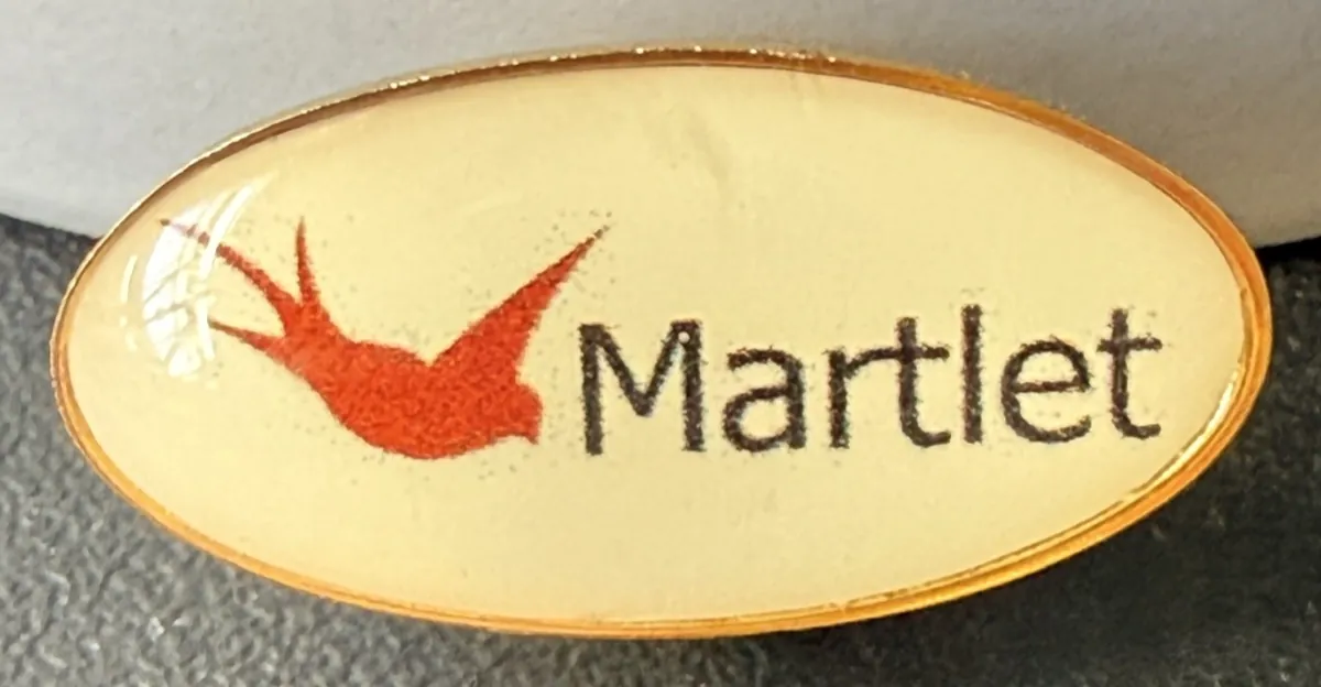 LP8 25mm oval pin badge printed with the Martlet logo