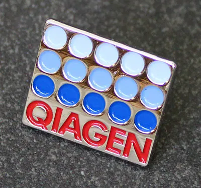 Qiagen logo enamel pin badge with blue dots and red lettering