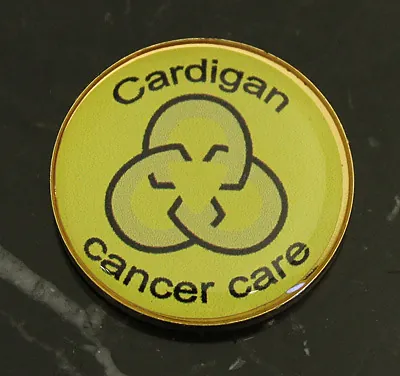 Cardigan Cancer Care round printed pin badge in gold